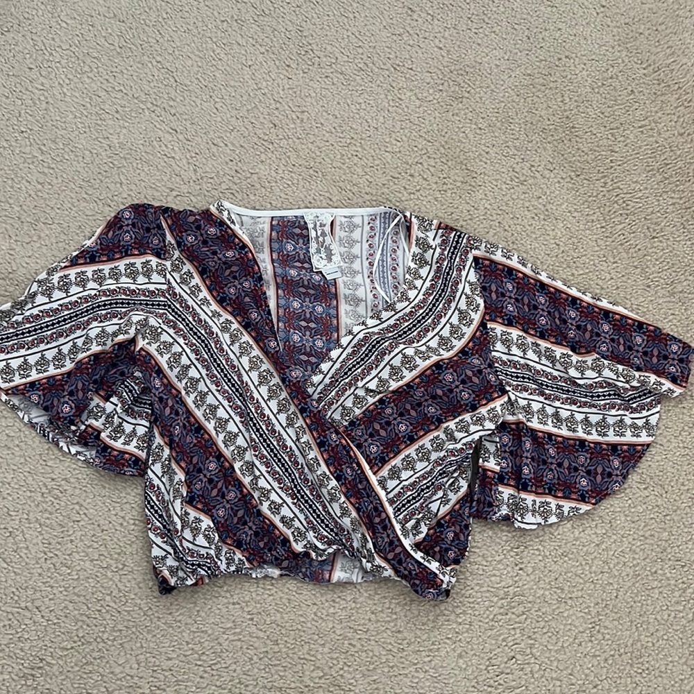 Sadie and Sage small, multi-colored cropped shirt.